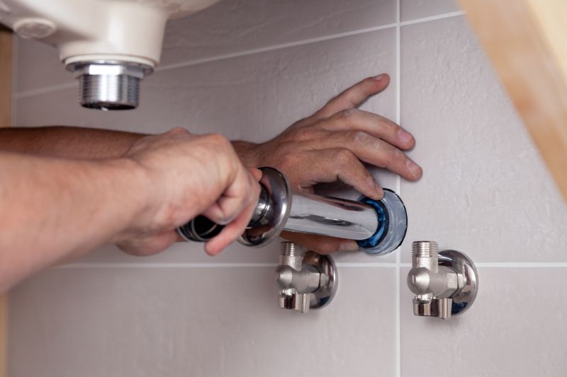Plumber Installing Fixtures